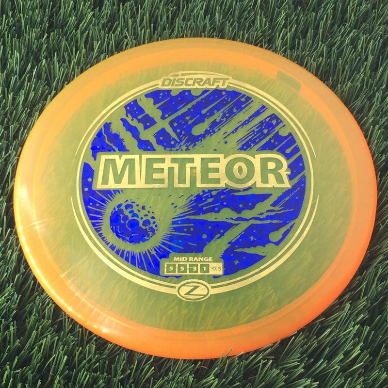 Discraft Elite Z Meteor with Meteor Shower Double Foil Stamp - 176g - Translucent Orange