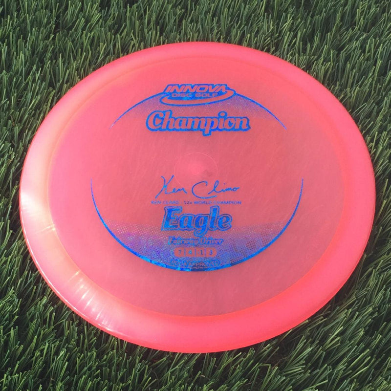 Innova Champion Eagle with Ken Climo - 12x World Champion New Stamp Stamp - 148g - Translucent Pink