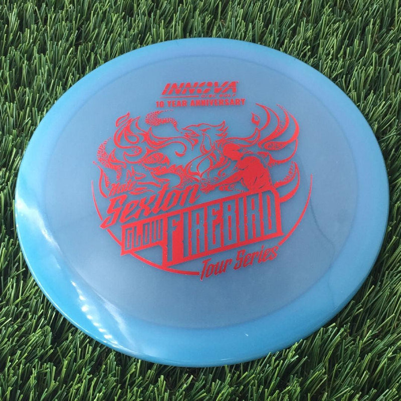 Innova Proto Color Glow Champion Firebird with Nate Sexton "Sexybird" 10 Year Anniversary Tour Series Stamp - 175g - Translucent Blue