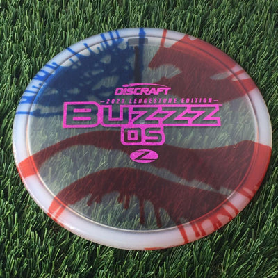 Discraft Elite Z Fly-Dyed BuzzzOS with 2023 Ledgestone Edition - Wave 2 Stamp - 180g - Translucent Flag