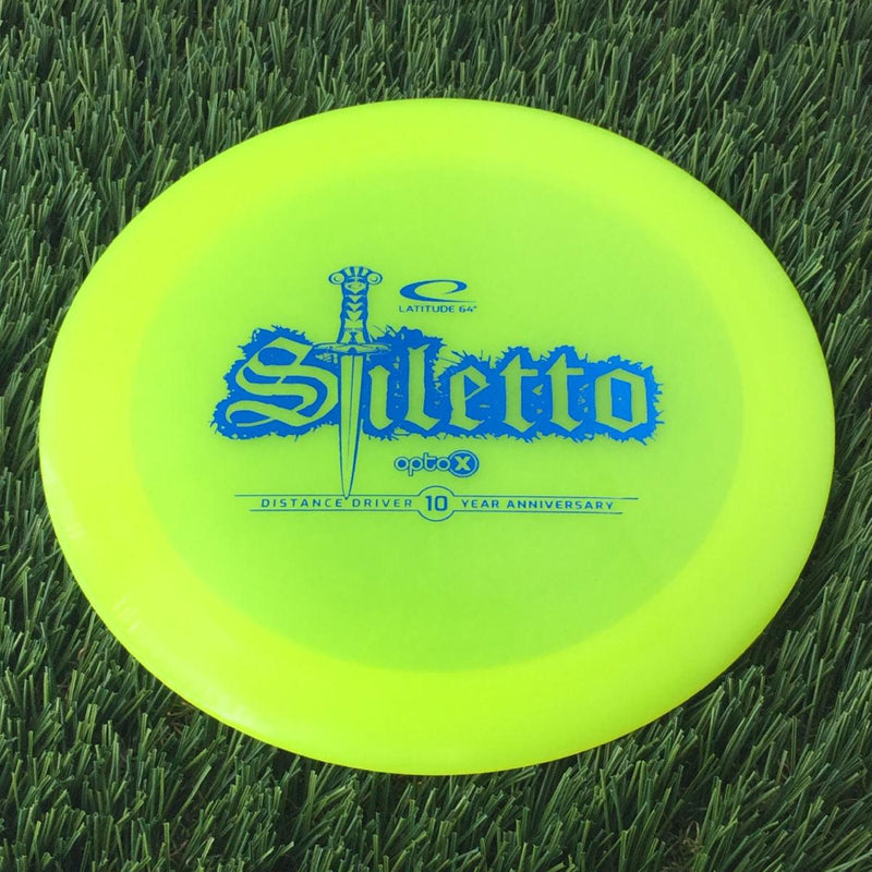 Latitude 64 Opto-X Stiletto with 10 Year Anniversary Sword Stamp - 174g - Translucent Yellow