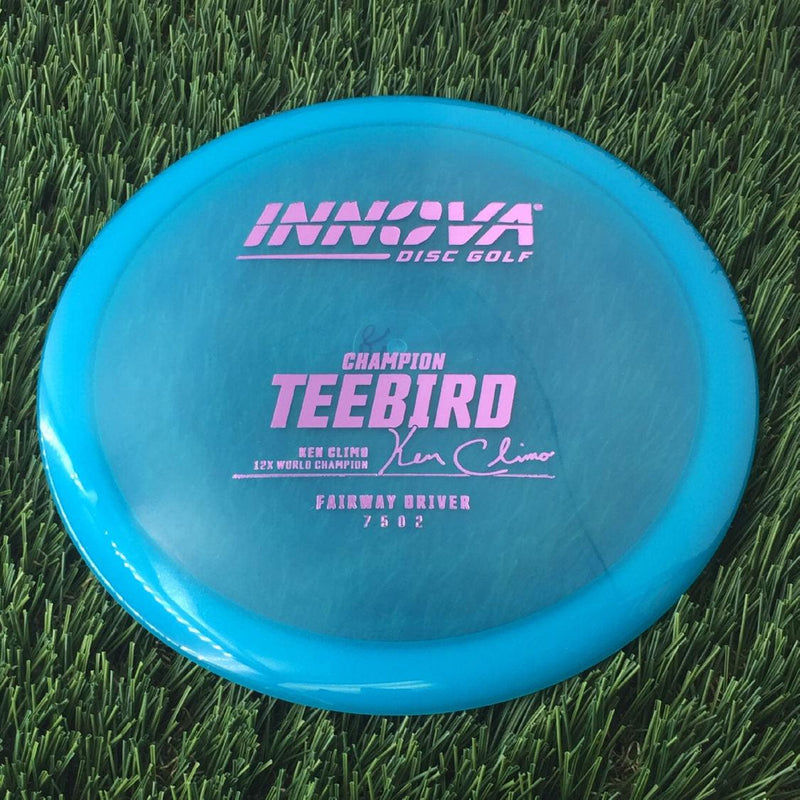 Innova Champion Teebird with Ken Climo 12x World Champion Burst Logo Stamp - 166g - Translucent Blue