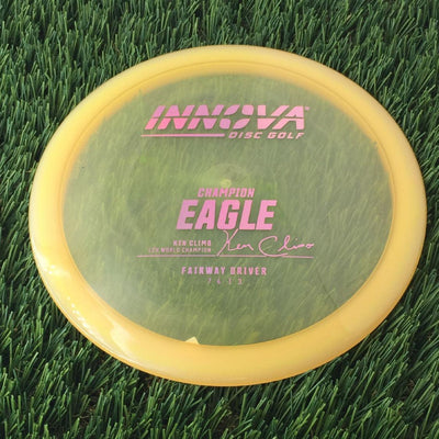 Innova Champion Eagle with Ken Climo 12X World Champion Signature Burst Logo Stock Stamp - 167g - Translucent Orangish Clear