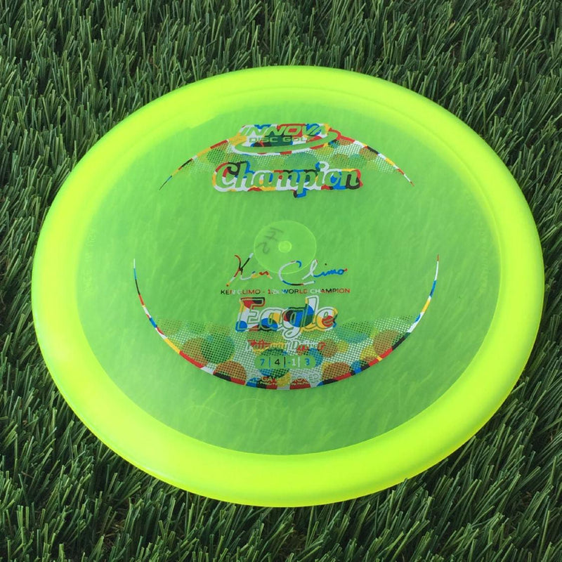 Innova Champion Eagle with Ken Climo - 12x World Champion New Stamp Stamp - 145g - Translucent Yellow