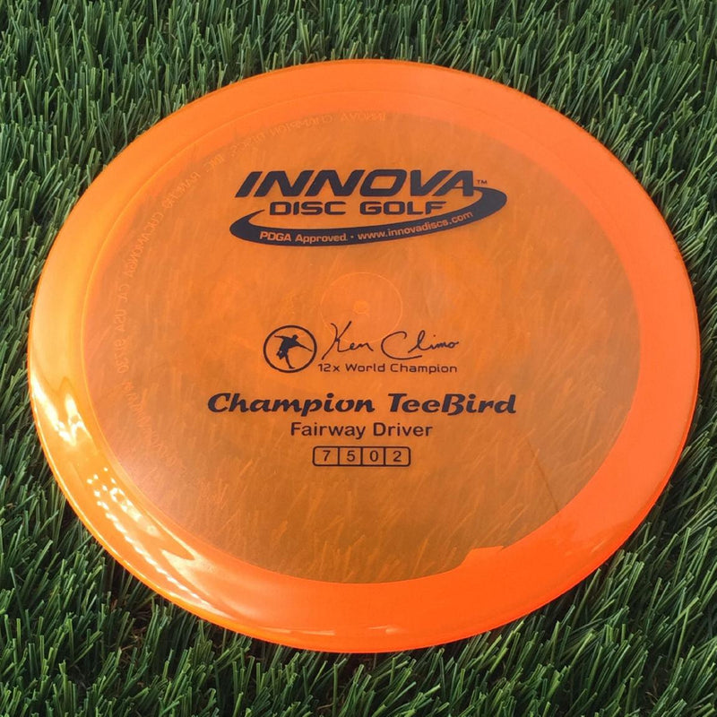 Innova Champion Teebird with Ken Climo 12x World Champion Stamp - 175g - Translucent Orange